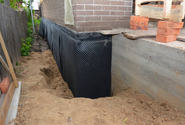 Happy homeowners after waterproofing job in Lomira